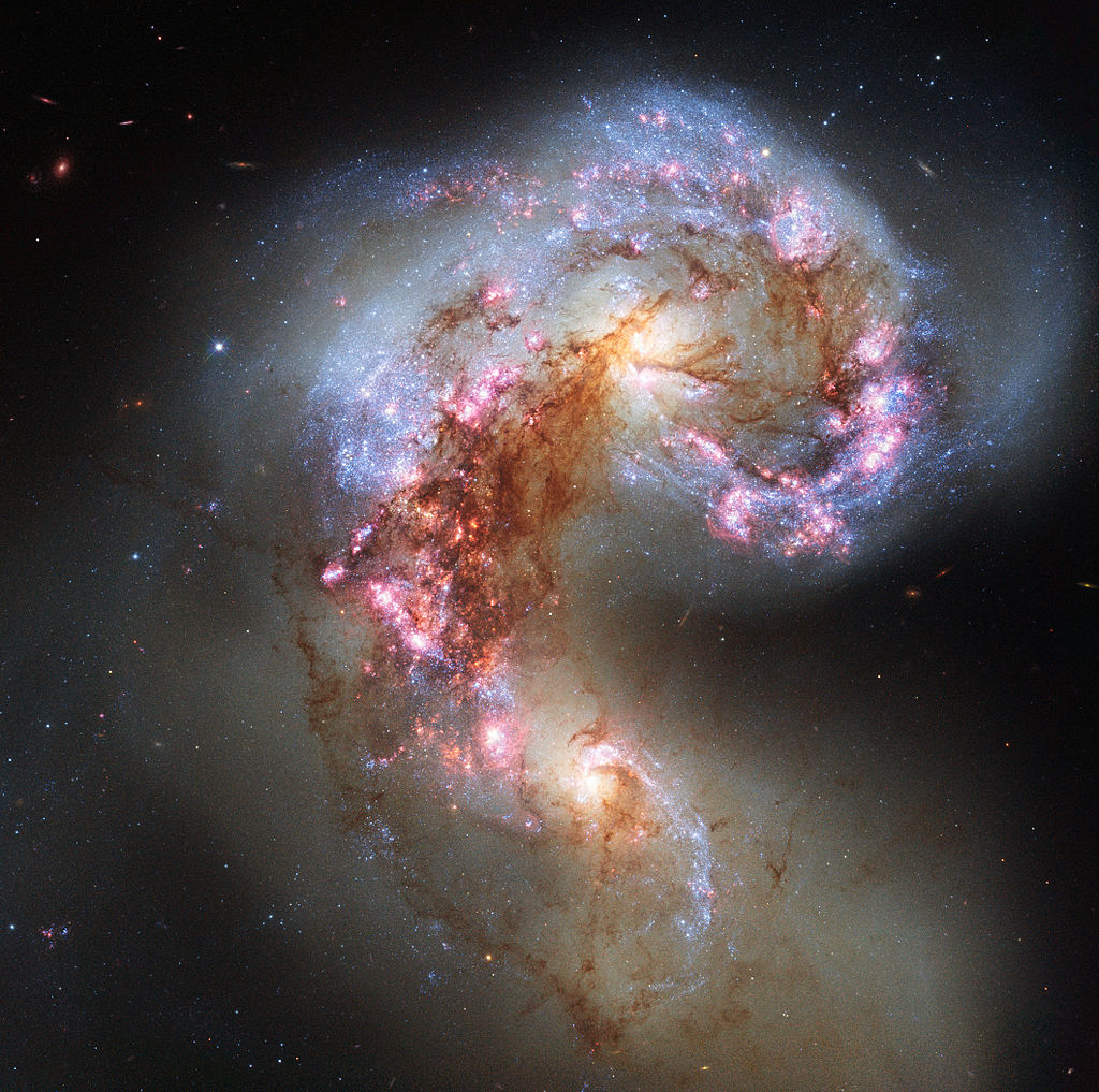 Two spiral galaxies, known as the Antennae Galaxies,  colliding. Source: NASA/ESA/Hubble